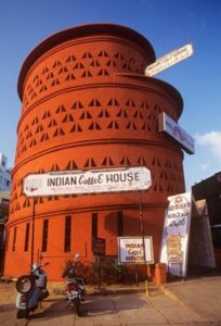 Alt text: Cylindrical brick Indian Coffee House in Thiruvananthapuram, Kerala, India featuring Jaali walls
